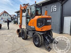 Bageri na kotačima, Ostali DX100W-7 - POWERTILT - 4X ŽLICE - STABILIZATORJI